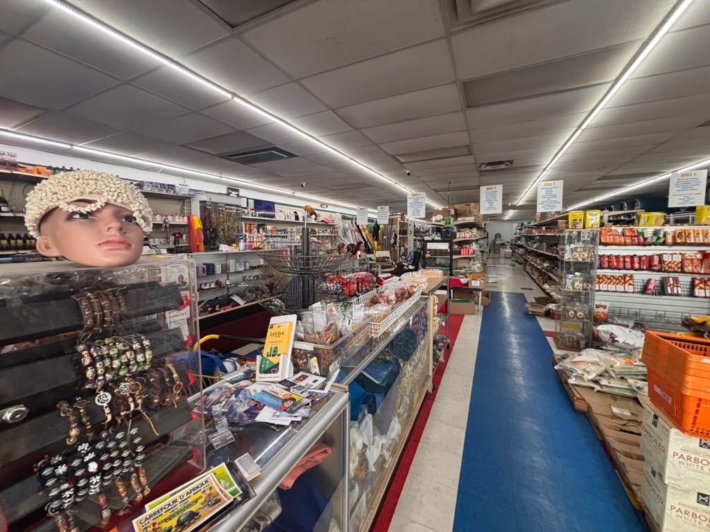 Kintampo African Market aisle — jewelry, rice, and grocery shelves